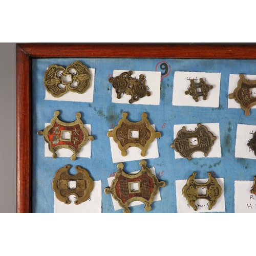 185 - A group of 99 Korean bronze and metal amulets or charms, 19th/20th century largest 70mmCONDITION: tr... 