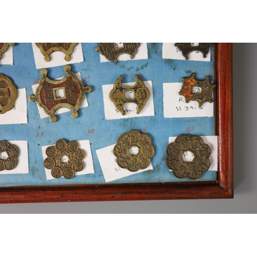 185 - A group of 99 Korean bronze and metal amulets or charms, 19th/20th century largest 70mmCONDITION: tr... 