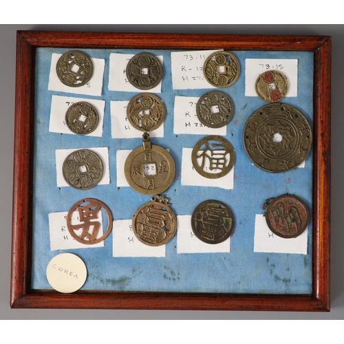 185 - A group of 99 Korean bronze and metal amulets or charms, 19th/20th century largest 70mmCONDITION: tr... 