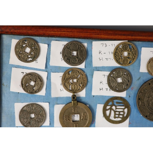 185 - A group of 99 Korean bronze and metal amulets or charms, 19th/20th century largest 70mmCONDITION: tr... 