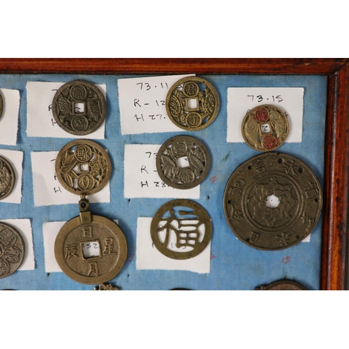 185 - A group of 99 Korean bronze and metal amulets or charms, 19th/20th century largest 70mmCONDITION: tr... 