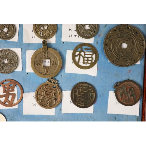 185 - A group of 99 Korean bronze and metal amulets or charms, 19th/20th century largest 70mmCONDITION: tr... 