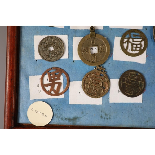 185 - A group of 99 Korean bronze and metal amulets or charms, 19th/20th century largest 70mmCONDITION: tr... 