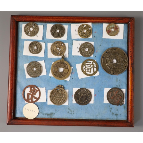 185 - A group of 99 Korean bronze and metal amulets or charms, 19th/20th century largest 70mmCONDITION: tr... 