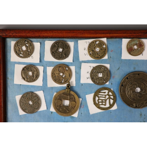 185 - A group of 99 Korean bronze and metal amulets or charms, 19th/20th century largest 70mmCONDITION: tr... 