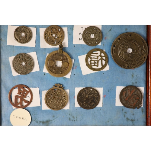 185 - A group of 99 Korean bronze and metal amulets or charms, 19th/20th century largest 70mmCONDITION: tr... 