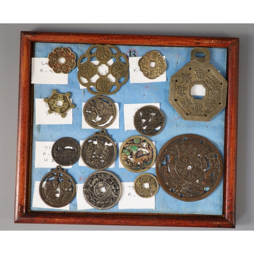 185 - A group of 99 Korean bronze and metal amulets or charms, 19th/20th century largest 70mmCONDITION: tr... 