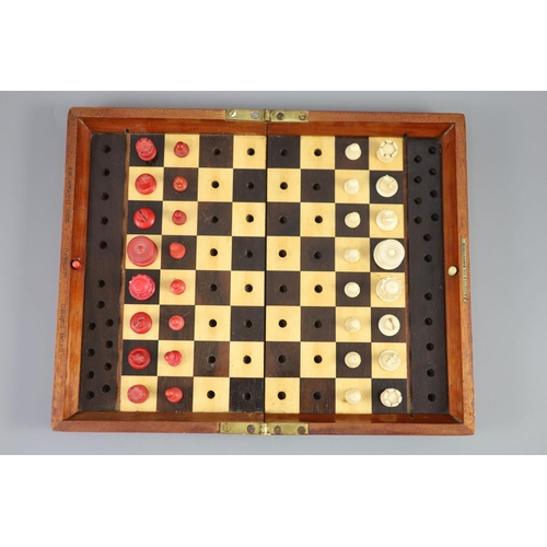 19 - A Jaques & Son Ltd In Statu Quo bone travelling chess set, in mahogany case, c.1860, with brass labe... 