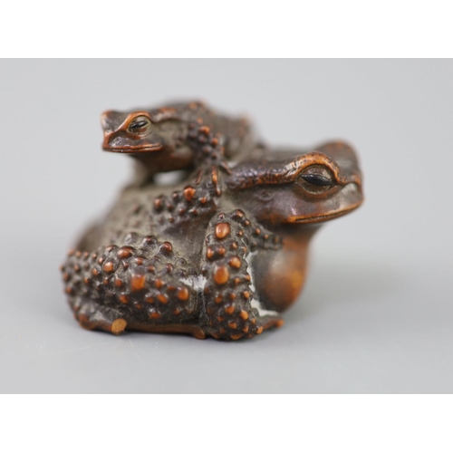 201 - A fine Japanese wood okimono of toads, signed Masanao, 19th century, with black horn inset eyes, eng... 