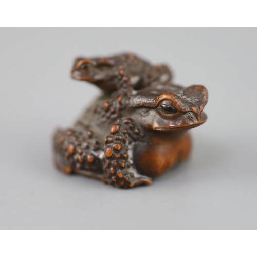 201 - A fine Japanese wood okimono of toads, signed Masanao, 19th century, with black horn inset eyes, eng... 