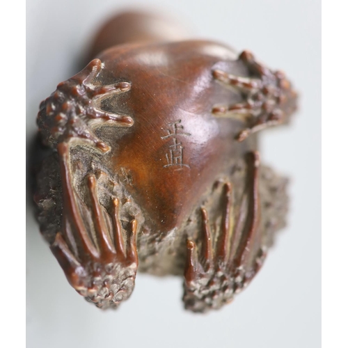 201 - A fine Japanese wood okimono of toads, signed Masanao, 19th century, with black horn inset eyes, eng... 