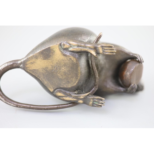 202 - A Japanese bronze model of a rat holding a chestnut, Meiji period, incised Kakihan mark to base, 17c... 