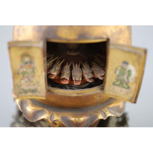 204 - A Japanese lacquer portable shrine (zushi), 19th century, of peach form opening to reveal a female i... 