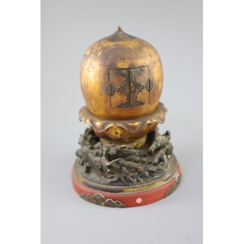 204 - A Japanese lacquer portable shrine (zushi), 19th century, of peach form opening to reveal a female i... 