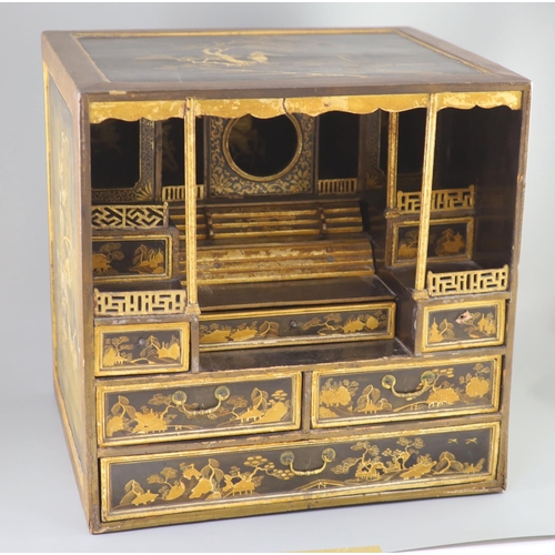 205 - A Japanese gilt decorated black lacquer shrine cabinet, 19th century, the top and sides decorated wi... 