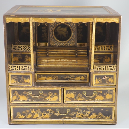 205 - A Japanese gilt decorated black lacquer shrine cabinet, 19th century, the top and sides decorated wi... 