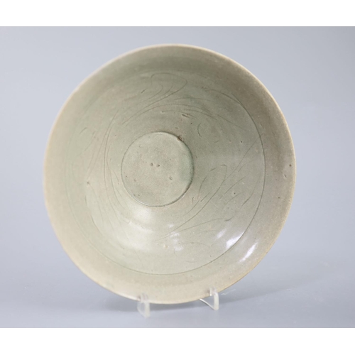 212 - A Chinese celadon bowl, Song-Yuan dynasty of conical form, the interior incised with foliage, 18.2cm... 