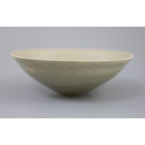 212 - A Chinese celadon bowl, Song-Yuan dynasty of conical form, the interior incised with foliage, 18.2cm... 