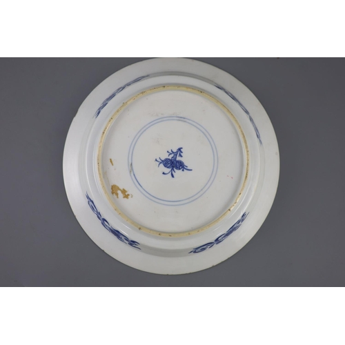 215 - A Chinese blue and white 'sage and phoenix' dish, Kangxi period, painted with the seated figure of a... 