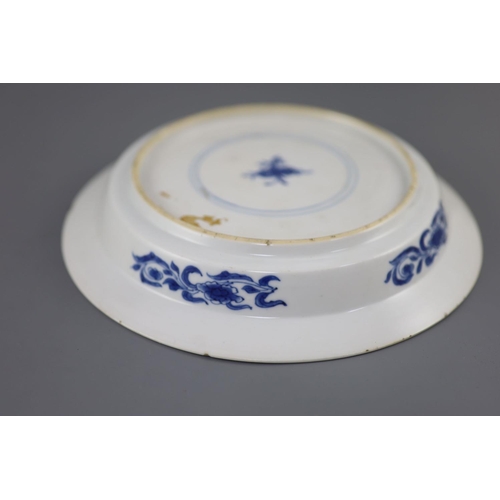 215 - A Chinese blue and white 'sage and phoenix' dish, Kangxi period, painted with the seated figure of a... 