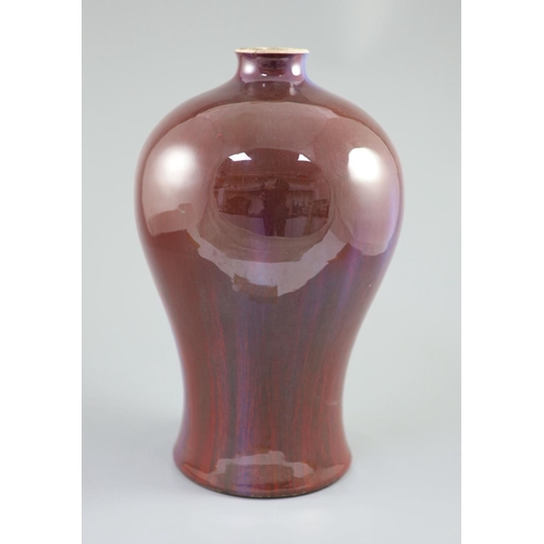 218 - A large Chinese flambe meiping, 18th century, the ox blood glaze with purple and violet streaks, bro... 