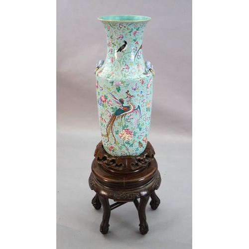 220 - A large Chinese famille rose turquoise ground baluster vase, first half 19th century, painted with v... 