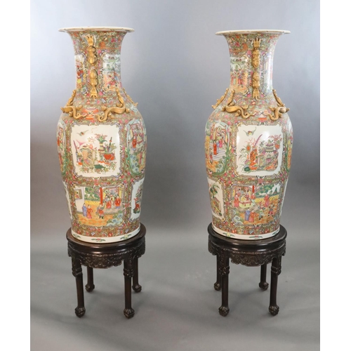 234 - A pair of massive Chinese Canton style famille rose vases, 20th century and a pair of Chinese hongmu... 