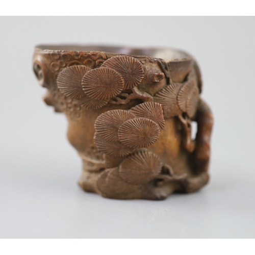 237 - A Chinese bamboo root 'pine' libation cup, 17th/18th century, carved in high relief and openwork as ... 