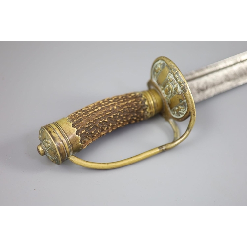 24 - A late 17th century military hangar sword, with brass hilt, antler handle and blade engraved with cl... 