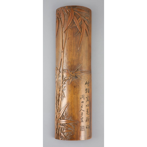 241 - A Chinese bamboo 'bamboo sprig' wrist rest, 18th century, carved in high relief with bamboo and inci... 