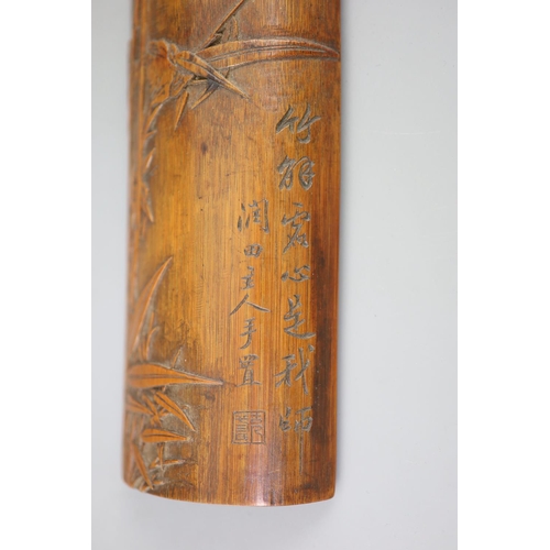 241 - A Chinese bamboo 'bamboo sprig' wrist rest, 18th century, carved in high relief with bamboo and inci... 