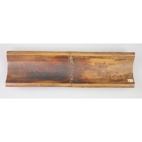 241 - A Chinese bamboo 'bamboo sprig' wrist rest, 18th century, carved in high relief with bamboo and inci... 