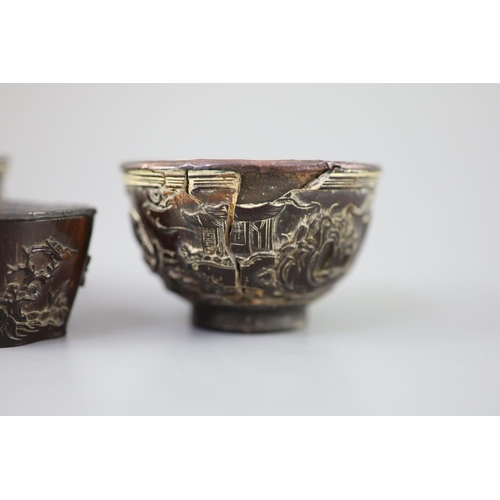 245 - A pair of Chinese coconut 'landscape' cups and a similar peach-shaped cup, 18th/19th century, the pa... 