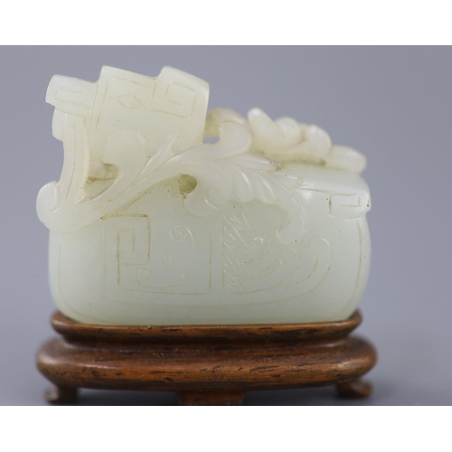 252 - A Chinese archaistic pale celadon jade mandarin duck carving, 19th century, the duck biting a sprig ... 