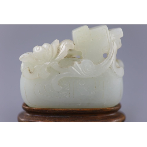 252 - A Chinese archaistic pale celadon jade mandarin duck carving, 19th century, the duck biting a sprig ... 