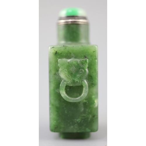 255A - A good Chinese spinach green jade rectangular snuff bottle, 18th/19th century, the sides carved in r... 