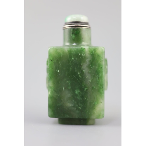 255A - A good Chinese spinach green jade rectangular snuff bottle, 18th/19th century, the sides carved in r... 