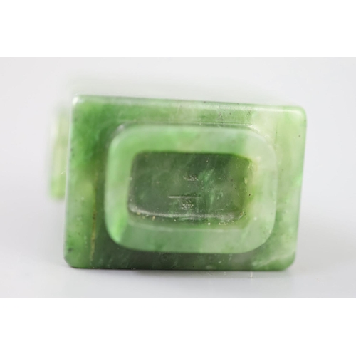 255A - A good Chinese spinach green jade rectangular snuff bottle, 18th/19th century, the sides carved in r... 