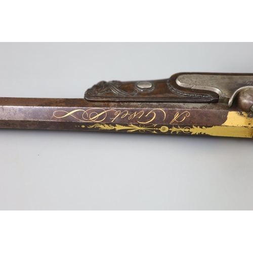 26 - A late 18th/ early 19th century French gold inlaid pistol by Henraux with finely carved walnut stock... 