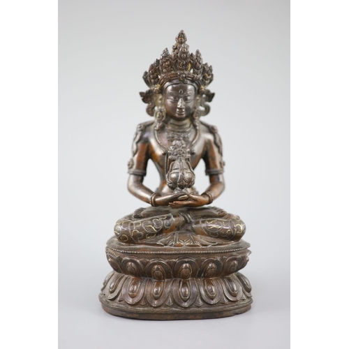 265 - A Tibetan silver and gold inlaid copper alloy figure of Amitayus/Amitabha, c.15th century, seated in... 