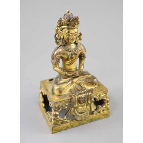 272 - A Chinese gilt bronze seated figure of Amitayus, Qianlong period, dated 1770, the crowned figure hol... 