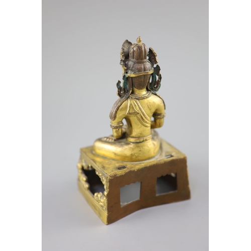 272 - A Chinese gilt bronze seated figure of Amitayus, Qianlong period, dated 1770, the crowned figure hol... 