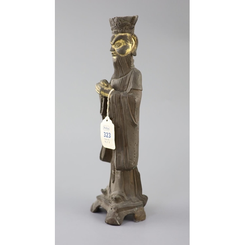 274 - A Chinese bronze standing figure of an Emperor, late Ming dynasty, remnants of gilding to his face a... 