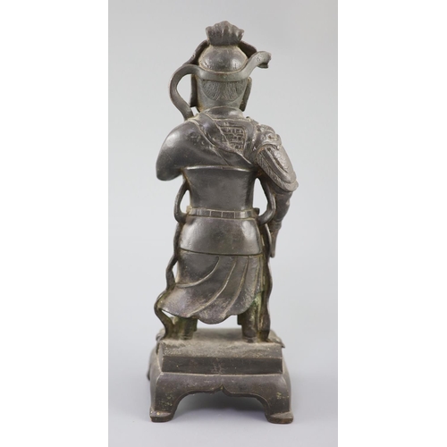 279 - A Chinese bronze standing figure of Guandi, 16th/17th century, wearing armour and robes with flowing... 