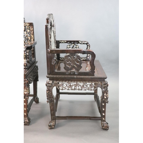 283 - An impressive pair of Chinese hongmu and mother of pearl inlaid throne armchairs, c.1910, each decor... 