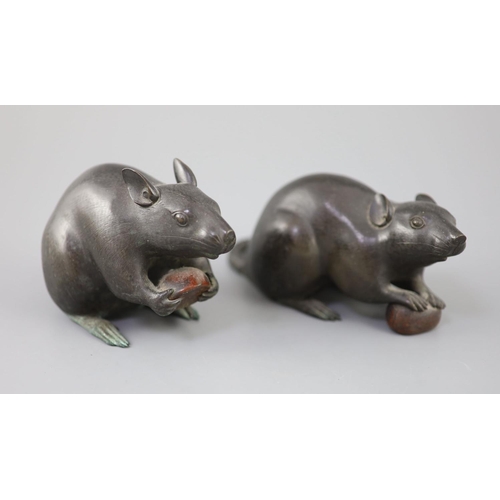 292 - A pair of Japanese bronze models of rats, Meiji period, signed each holding a chestnut, inscribed th... 