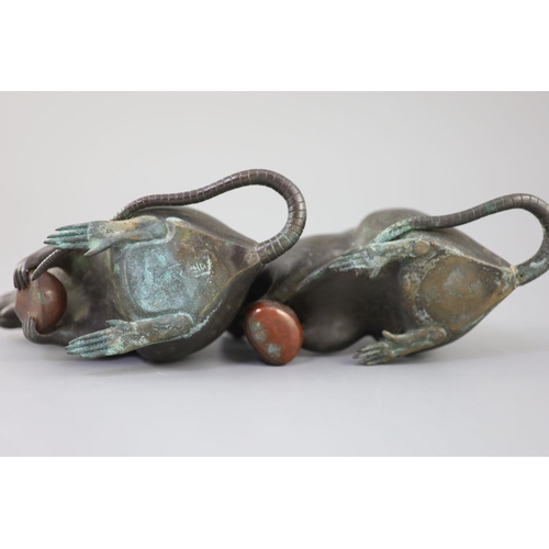 292 - A pair of Japanese bronze models of rats, Meiji period, signed each holding a chestnut, inscribed th... 