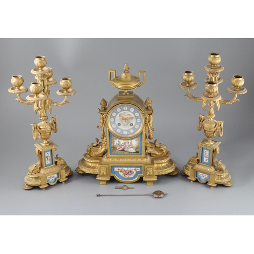 296 - A 19th century Louis XVI style ormolu and Sevres style porcelain clock garniture, the mantel clock o... 