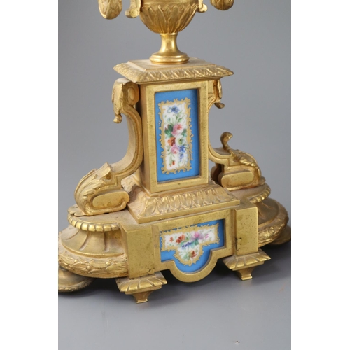 296 - A 19th century Louis XVI style ormolu and Sevres style porcelain clock garniture, the mantel clock o... 