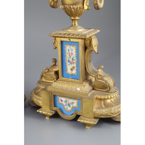 296 - A 19th century Louis XVI style ormolu and Sevres style porcelain clock garniture, the mantel clock o... 